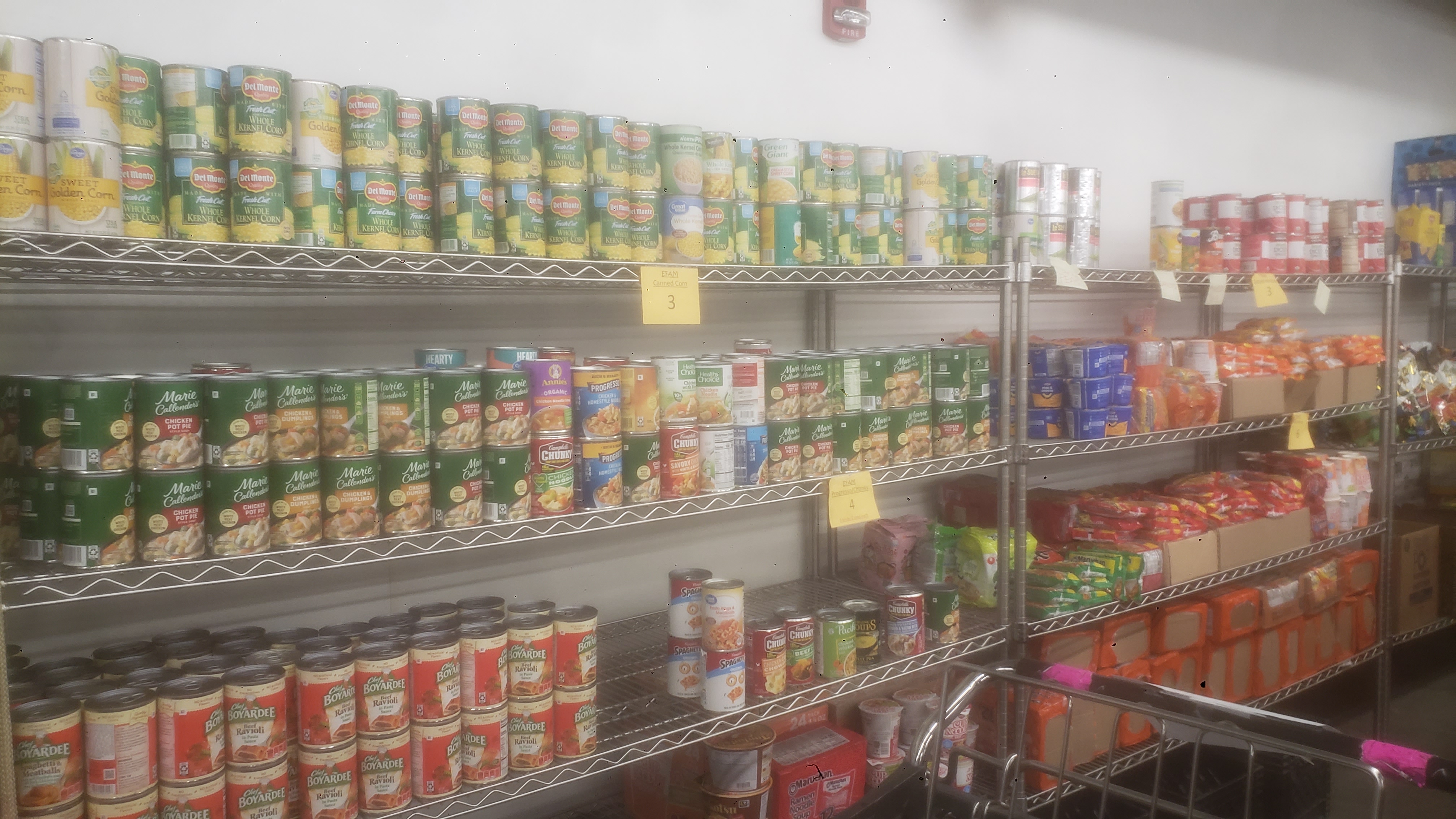 Shelves of canned goods and packaged food.
